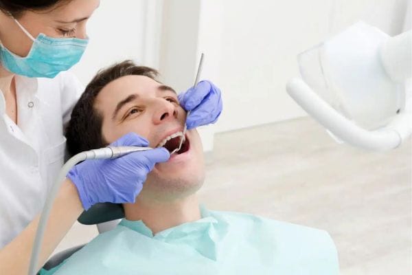 Dental examinations Man sat in chair whilst having a dental examination