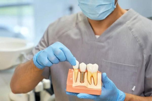 Dentist undertaking a dental implant