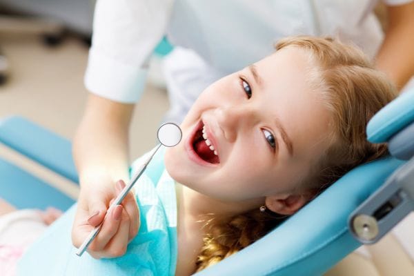 child having family dentistry examination
