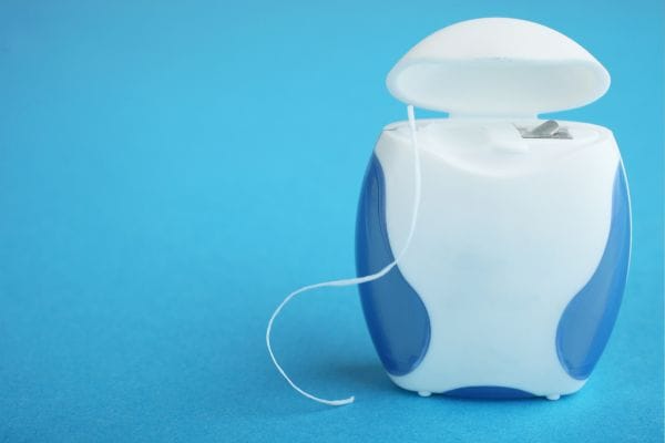 Dental floss on a blue background